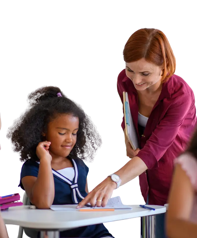 Teacher providing tutoring to a young student as part of Helping Hands Society mentoring program